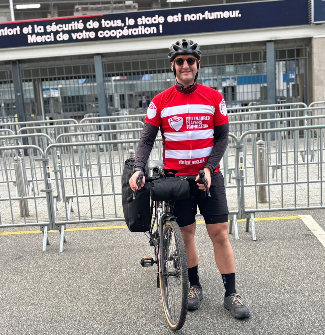 Nick Anderton arrives at Stade De France Paris after cycling 200 miles from Twickenham for the Injured Players Foundation