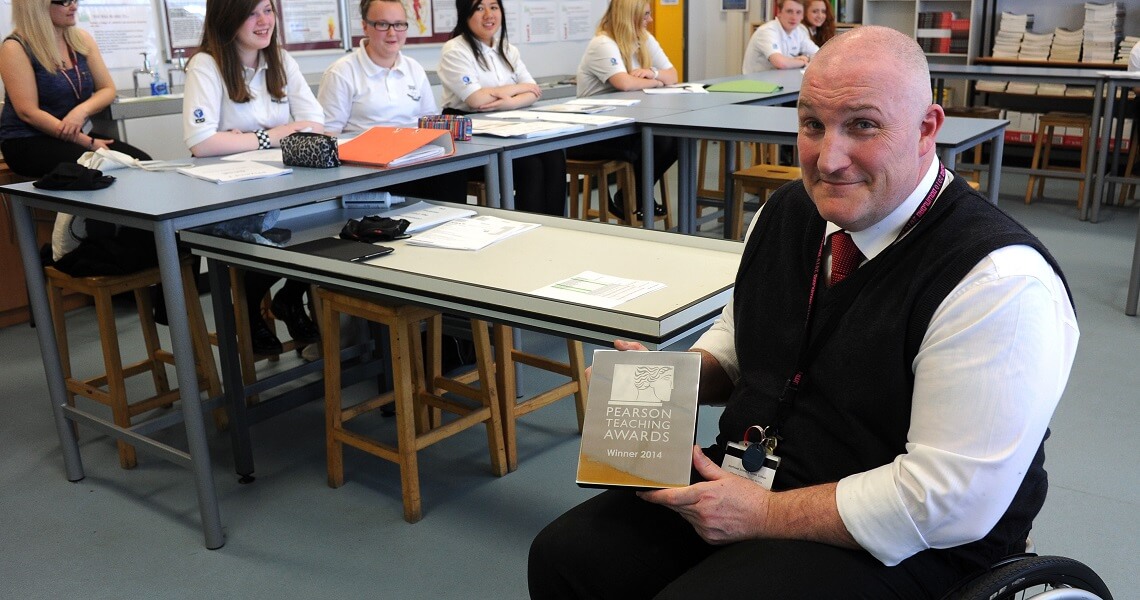 John B client showing teacher award