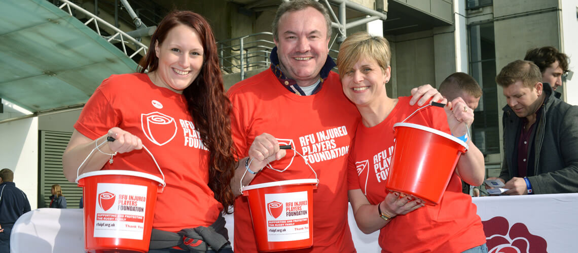 3 people collecting money at Allianz Stadium for the RFU Injured Players Foundation